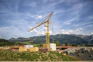 Scenic view at a new construction site with crane and building materials. photo