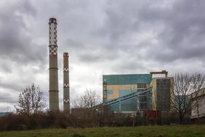 Factory with industrial chimney. Industry concept image. photo