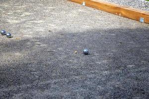 Petanque balls in the playing field, Ball of petanque is iron for a throw at relaxing time photo