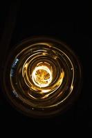 art of lighting of incandescent bulb. Close up. Vertical view photo