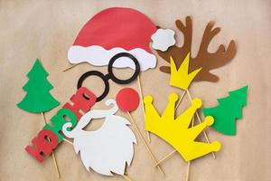 Photo booth colorful props for christmas party - mustache, santa claus, fir tree, glasses, crown, antler, nose, hat