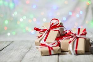 Christmas gift box against bokeh background. Holiday greeting card photo