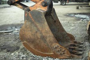 Escalator bucket. Heavy machinery. Rusty bucket. photo