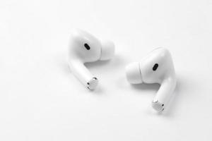 Ternopil, Ukraine - May 8, 2022 Apple AirPods Pro on a white background. Wireless headphones. Apple Inc. is an American technology company photo