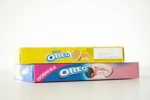 Ternopil, Ukraine - May 8, 2022 Oreo golden and strawberry cheesecake crispy cookie box. The brand Oreo is owned by company Mondelez international photo