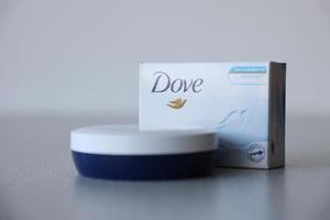 Ternopil, Ukraine - May 8, 2022 Production with Dove Logo on textured surface photo