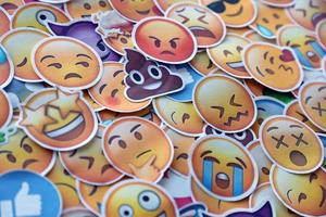 Ternopil, Ukraine - May 8, 2022 Large set of stickers with Emoji yellow faces. Emoji is a pictogram or smiley embedded in text and used in electronic messages and web page photo