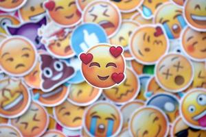 Ternopil, Ukraine - May 8, 2022 Large set of stickers with Emoji yellow faces. Love pictogram in focus photo