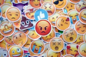 Ternopil, Ukraine - May 8, 2022 Large set of stickers with Emoji yellow faces. Angry pictogram in focus photo