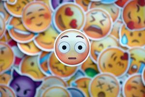 Ternopil, Ukraine - May 8, 2022 Large set of stickers with Emoji yellow faces. Wow pictogram in focus photo