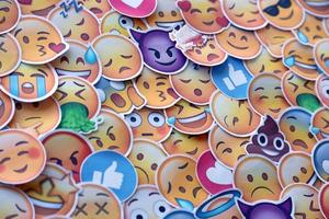 Ternopil, Ukraine - May 8, 2022 Large set of stickers with Emoji yellow faces. Emoji is a pictogram or smiley embedded in text and used in electronic messages and web page photo