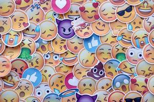 Ternopil, Ukraine - May 8, 2022 Large set of stickers with Emoji yellow faces. Emoji is a pictogram or smiley embedded in text and used in electronic messages and web page photo