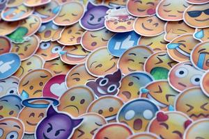 Ternopil, Ukraine - May 8, 2022 Large set of stickers with Emoji yellow faces. Emoji is a pictogram or smiley embedded in text and used in electronic messages and web page photo