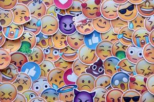 Ternopil, Ukraine - May 8, 2022 Large set of stickers with Emoji yellow faces. Emoji is a pictogram or smiley embedded in text and used in electronic messages and web page photo