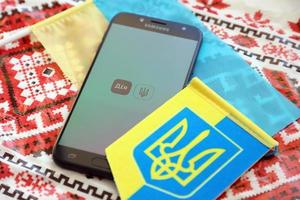 Ternopil, Ukraine - April 21, 2022 Diia app on smartphone screen. Diya is a mobile application with web portal and a brand of e-governance in Ukraine photo