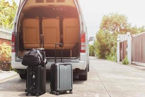 Road trip with traveling van and suitcase travel concept. photo