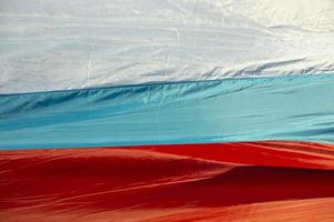 Fabric of flag of Russia. Details of canvas in three colors. photo