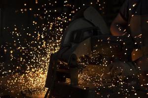 Sparks from welding. Metal cutting. Production details. photo
