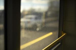Glass in bus. Dusty glass in transport. photo