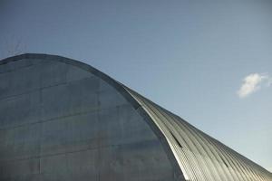 Warehouse is round in shape. Steel building. Storage in detail. photo