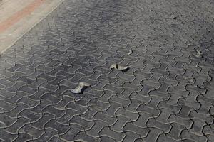 part of the road made of concrete tiles photo