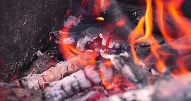A fire made of logs while cooking barbecue on vacation at the weekend photo