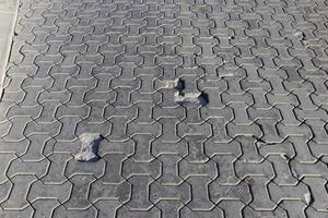 part of the road made of concrete tiles photo