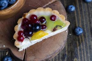 delicious cake with different berries photo