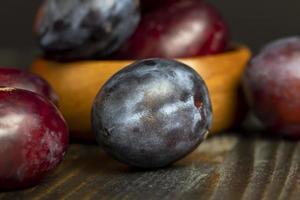 Ripe plums on the table in the kitchen photo