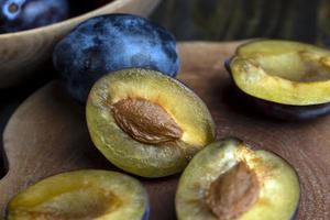 Ripe plums on the table in the kitchen photo