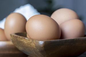 Chicken eggs lying on the table photo