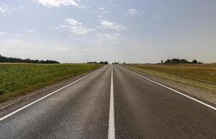 Narrow paved road for cars photo