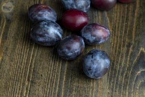 Ripe plums on the table in the kitchen photo