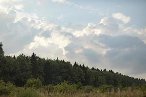 Clouds over forest. View of nature. Beauty of landscape. photo