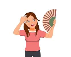 Beautiful young woman suffering heat wave stoke in very hot weather using hand fan and tissue to dry sweat vector