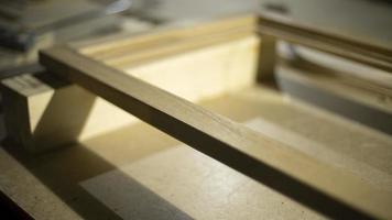 Boards in carpentry workshop. Raw wood. Details of furniture creation. photo