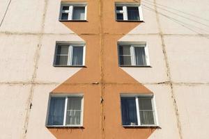 Window to building. Ordinary house in detail. Residential building in city. photo