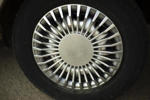 Car wheel. Hubcap on wheel. Vehicle tuning details. Drive wheel. Retro style. photo