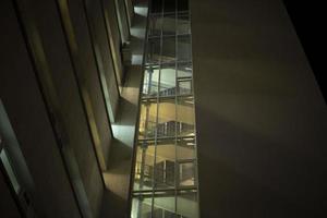 Flattery in building outside. View of windows in house. photo