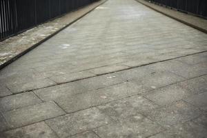 Road is made of tiles. Pedestrian area. photo