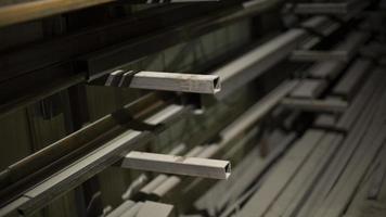 Steel profile on shelves. Metal storage details. Warehouse in shop. photo