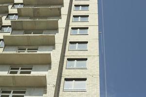 Windows in new house. Construction of residential complex. Building is made of concrete. Architecture details. photo