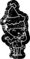 happy cartoon distressed icon of a boy wearing santa hat vector