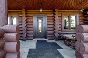 wooden doors to a country log house photo