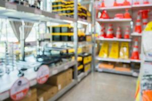 Work tool and traffic cone on shelves in home improvement store photo