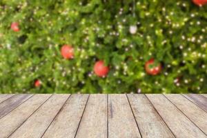 wood floor with decorations on the Christmas tree photo