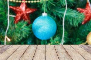 Christmas holiday background with empty rustic wood table photo