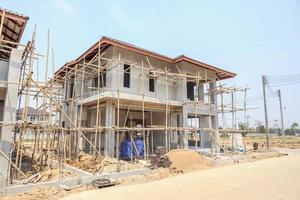 house under construction with autoclaved aerated concrete block structure at building site photo