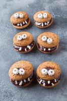 Cookies with chocolate paste in the form of monsters for Halloween photo