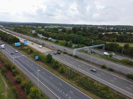 High Angle View of British Motorways with Traffic. The Aerial footage of British Roads and Motorways at between M1 Junction 7 and 9 at Sunset. The Footage captured on 09-07-2022 with drone's camera photo